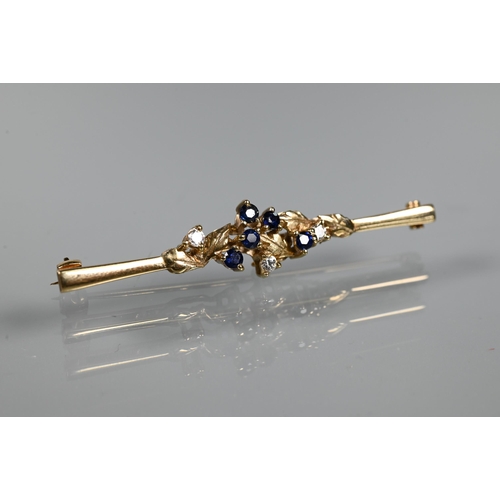 215 - A 9ct yellow gold bar brooch set with sapphires and diamonds in leaf tendril setting, 5 cm long, app... 