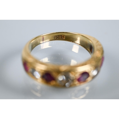 216 - An antique 18ct yellow gold ring set with nine graduated alternate set ruby and diamonds, in carved ... 