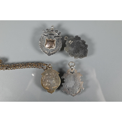 219 - Three silver Victorian shield fobs, a silver-cased pocket watch, silver-gilt belcher chain and gilt ... 