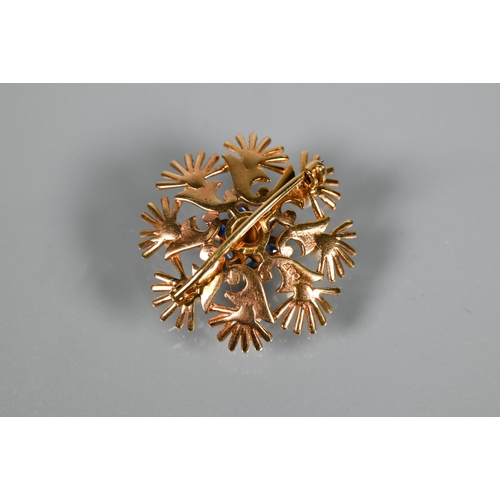 220 - A 9ct yellow gold circular brooch in the form of leaf fronds enclosing seed pearls and with pearl an... 