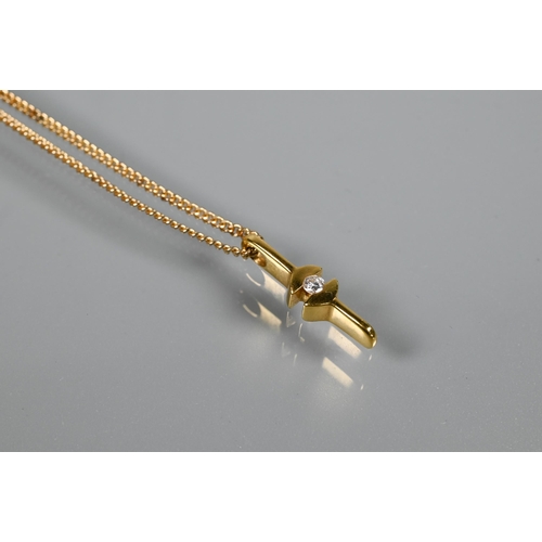 221 - An 18ct yellow gold diamond-set pendant on 9ct yellow gold trace chain