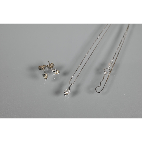 222 - A white metal diamond-set pendant on chain stamped 750 to/w a pair of matching diamond earrings for ... 