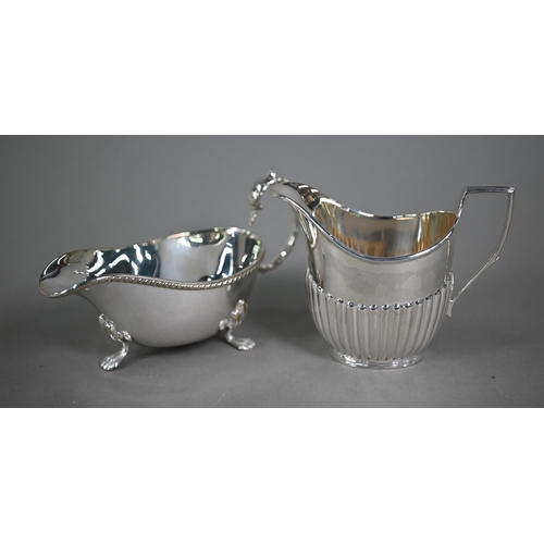 23 - A Victorian Scottish silver half-reeded milk jug, Hamilton & Inches, Edinburgh 1890, to/w a pair... 