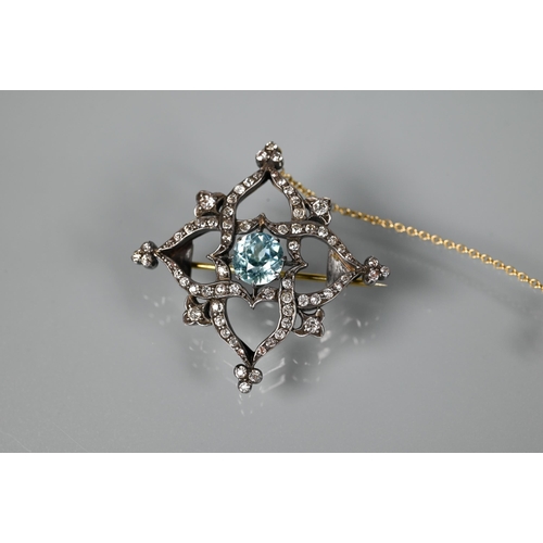 234 - A Victorian brooch, the central round zircon surrounded by an old cut diamond set shaped Gothic styl... 