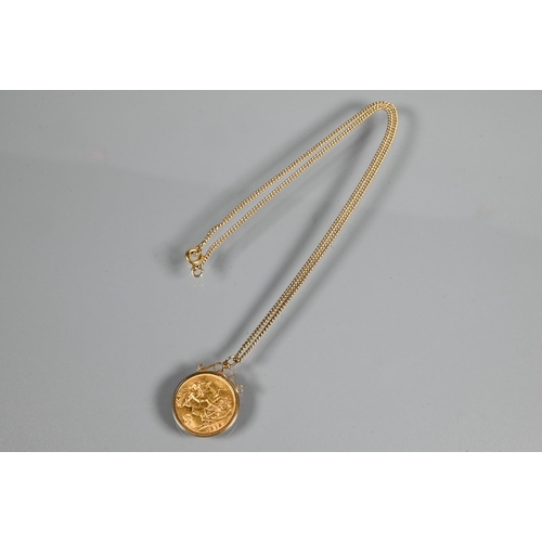 243 - A George V half sovereign dated 1914 in scroll mount, on 9ct yellow gold chain, approx 7.5g all in