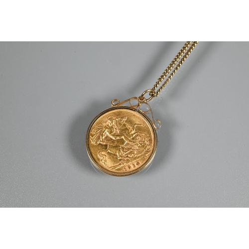 243 - A George V half sovereign dated 1914 in scroll mount, on 9ct yellow gold chain, approx 7.5g all in