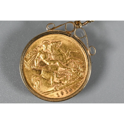 243 - A George V half sovereign dated 1914 in scroll mount, on 9ct yellow gold chain, approx 7.5g all in