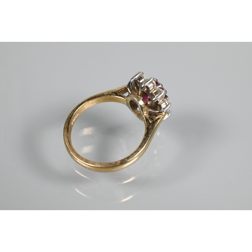 249 - A ruby and diamond cluster ring, the oval ruby with ten claw set diamonds around, 18ct yellow gold s... 