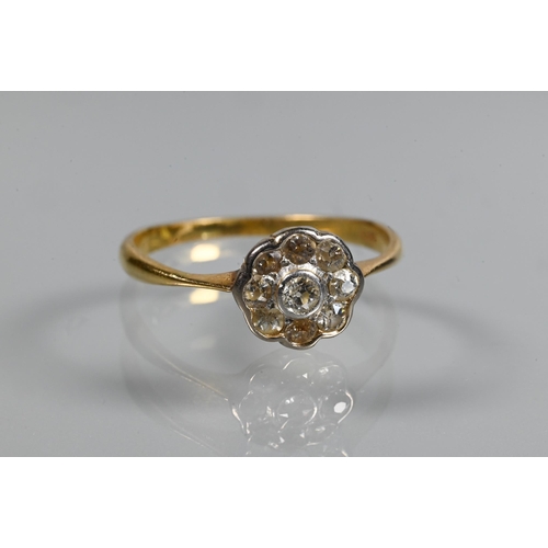 253 - An antique diamond cluster ring, the central old cut diamond with eight old cut diamonds around, 18 ... 