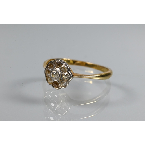 253 - An antique diamond cluster ring, the central old cut diamond with eight old cut diamonds around, 18 ... 