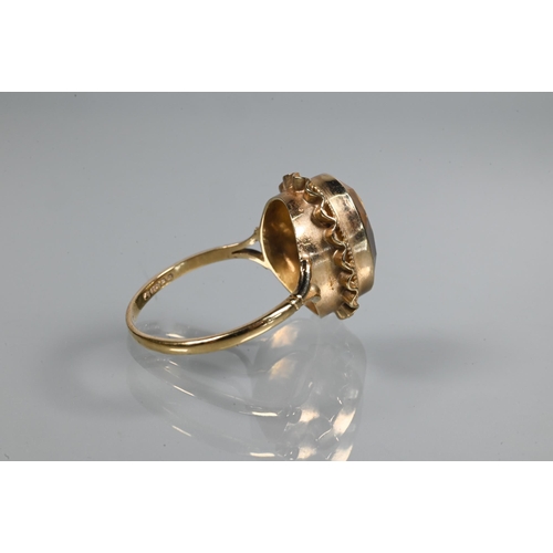 254 - An oval citrine ring set 9ct yellow gold with rope and scallop edge setting, size R 1/2