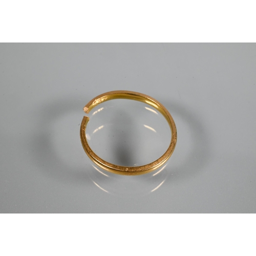 258 - A 22ct yellow gold wedding band (cut), approx 2.1g