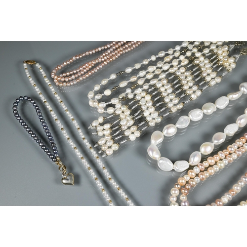 261 - A collection of modern freshwater and cultured pearls including large baroque shaped necklace, and t... 