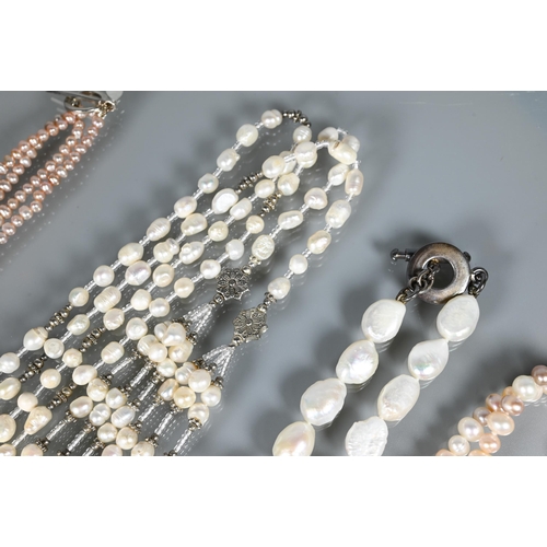 261 - A collection of modern freshwater and cultured pearls including large baroque shaped necklace, and t... 