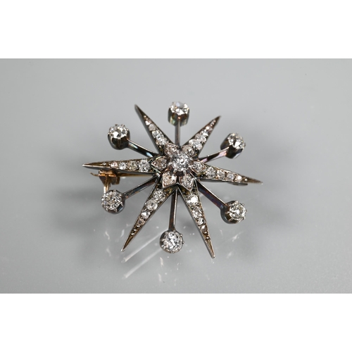 275 - A late Victorian diamond set starburst brooch, set overall with graduated old cut diamonds, yellow a... 