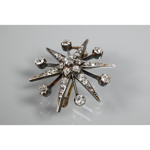 275 - A late Victorian diamond set starburst brooch, set overall with graduated old cut diamonds, yellow a... 