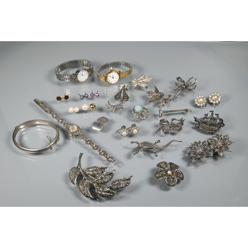 276 - A collection of marcasite and white metal jewellery items including brooches, bangle, wristwatches e... 