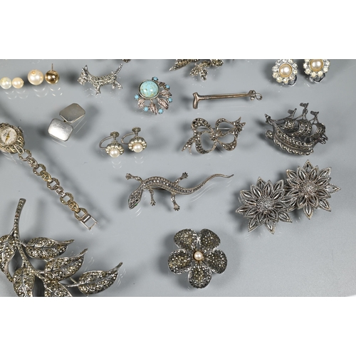 276 - A collection of marcasite and white metal jewellery items including brooches, bangle, wristwatches e... 