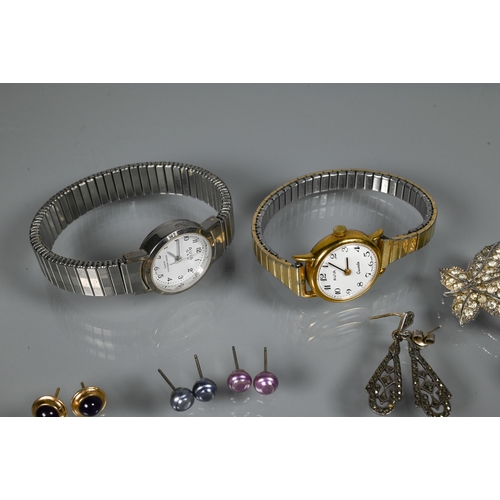 276 - A collection of marcasite and white metal jewellery items including brooches, bangle, wristwatches e... 