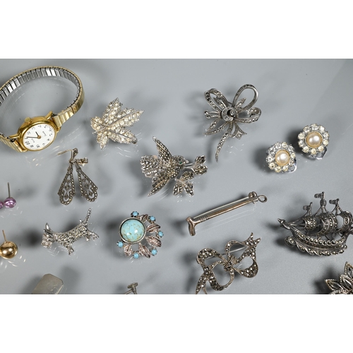 276 - A collection of marcasite and white metal jewellery items including brooches, bangle, wristwatches e... 