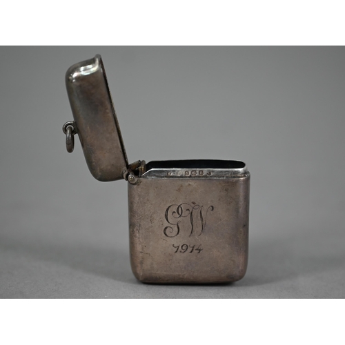 28 - A heavy quality silver vesta case, engraved 'GW 1914', Birmingham 1912, to/w an amber cheroot-holder... 