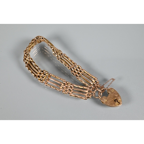 281 - A 9ct rose gold gatelink bracelet with padlock and chain attached, approx 16.3g