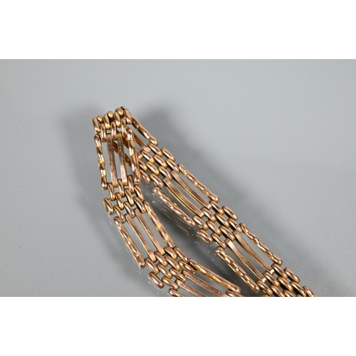 281 - A 9ct rose gold gatelink bracelet with padlock and chain attached, approx 16.3g