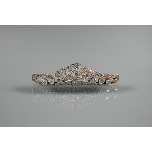 285 - An Art Deco diamond set shaped bar brooch, set overall with graduated millgrain edged round brillian... 