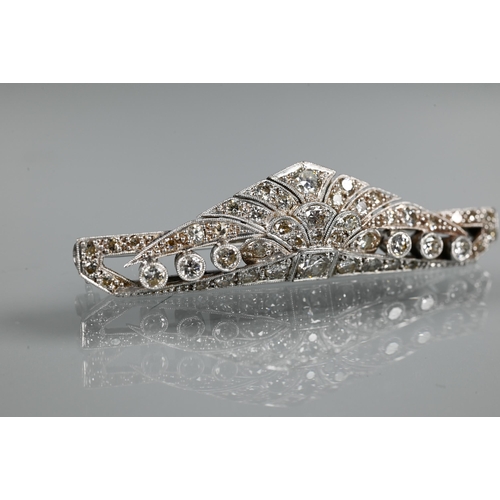 285 - An Art Deco diamond set shaped bar brooch, set overall with graduated millgrain edged round brillian... 