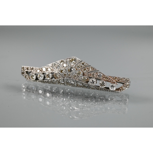 285 - An Art Deco diamond set shaped bar brooch, set overall with graduated millgrain edged round brillian... 