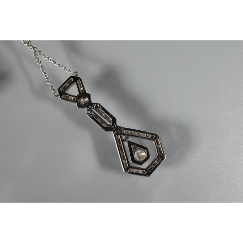 287 - An Art Deco diamond set pendant on chain of open stylised geometric form, with round brilliant cut m... 