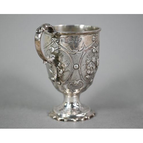 29 - WITHDRAWN A Victorian silver Christening cup with embossed floral decoration, scroll handle and stem... 