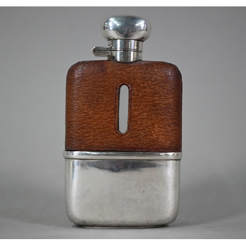 32 - A hip-flask with hinged silver top, leather cover and detachable silver beaker, Hubert Hall, Birming... 