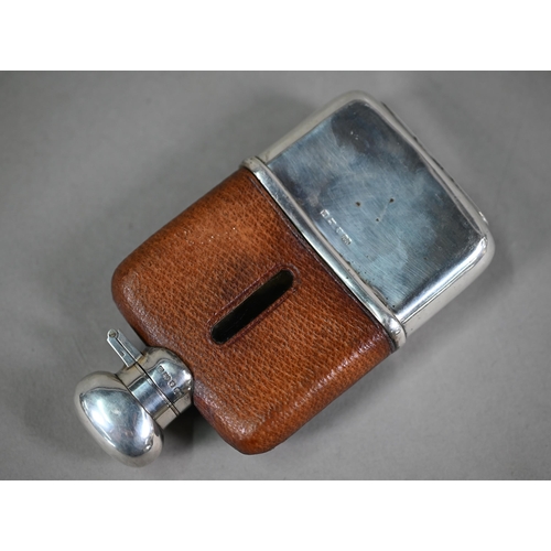 32 - A hip-flask with hinged silver top, leather cover and detachable silver beaker, Hubert Hall, Birming... 