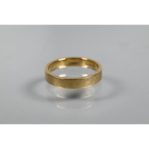 321 - A 9ct yellow gold wedding band of plain form, size U, approx 4.7g