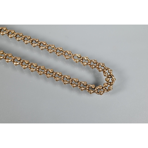 322 - A yellow gold fancy linked watch chain with swivel and associated bolt ring attached, stamped 10c, a... 