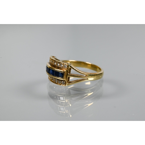 335 - A sapphire and diamond ring, the channel set central row of blue sapphires with row of brilliant cut... 