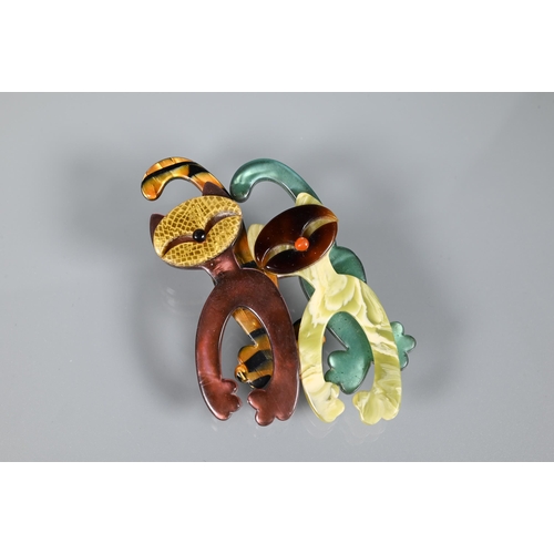 353 - Lea Stein, Paris - Three brooches in multi-colours modelled as two walking cats, 7 x 4.5 cm; a flowe... 