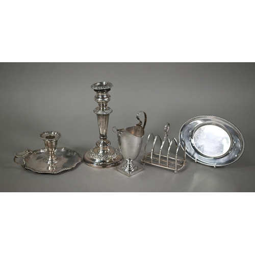 36 - A Victorian electroplated chamberstick, an Old Sheffield Plate candlestick and helmet cream jug, old... 