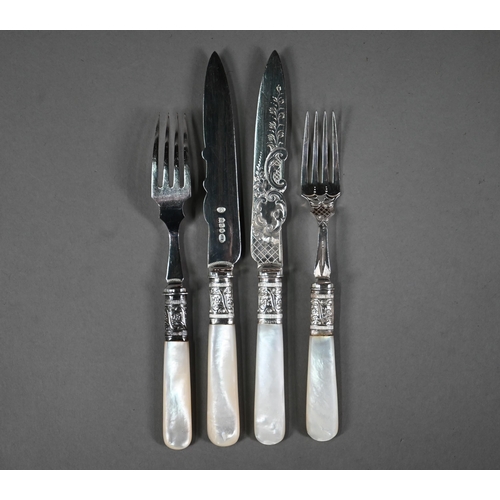 37 - An antique set of twelve electroplated dessert knives and forks with engraved blades and mother of p... 