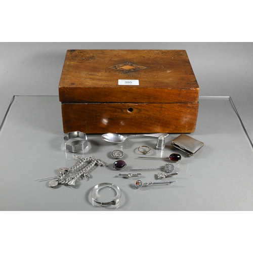 395 - A wooden box containing a quantity of silver items including child's expanding bangle, a double curb... 