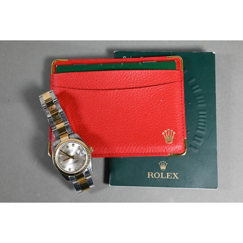 A ladies Rolex Oyster perpetual datejust wristwatch, stainless steel with bi-colour bracelet, the champagne dial; with diamond markers, model no. 69173, serial no. F922376 - with papers but no box, circa 2005