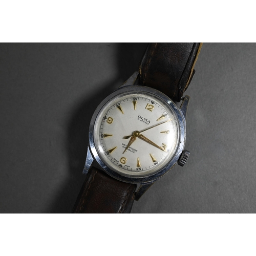 404 - A vintage gents Olma wristwatch, the champagne dial with gilt markers and hands within a 32 mm steel... 
