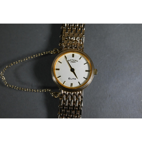 409 - A Rotary Elite 9ct lady's wristwatch, with white dial within a 21 mm dia. case on link strap - 19.6g... 