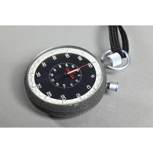 412 - A contemporary Omega stopwatch, 63 mm dia, on braided cord neck strap