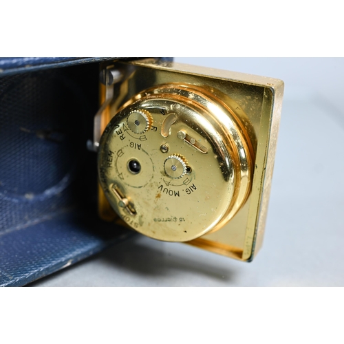 429 - A gilt metal Jaeger travel alarm clock to/with a vintage Waltham stainless steel wrist watch and a s... 