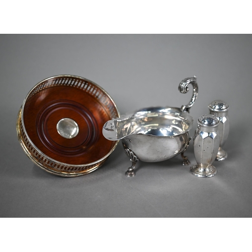 62 - A silver sauce-boat in the Georgian manner with scroll handle and hoof feet, Mappin & Webb, Shef... 