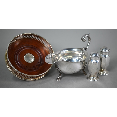 62 - A silver sauce-boat in the Georgian manner with scroll handle and hoof feet, Mappin & Webb, Shef... 