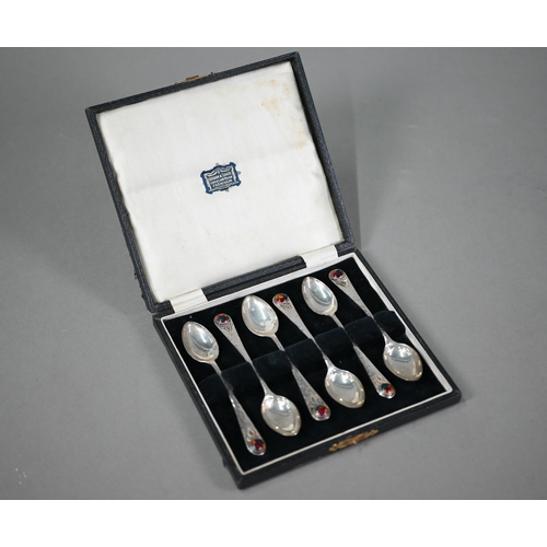 68 - Langstone Silverworks (Bernard Instone): a set of six planished silver teaspoons with enamel boss fi... 