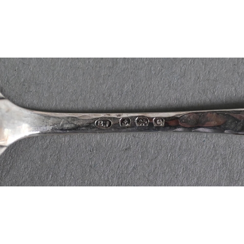 68 - Langstone Silverworks (Bernard Instone): a set of six planished silver teaspoons with enamel boss fi... 